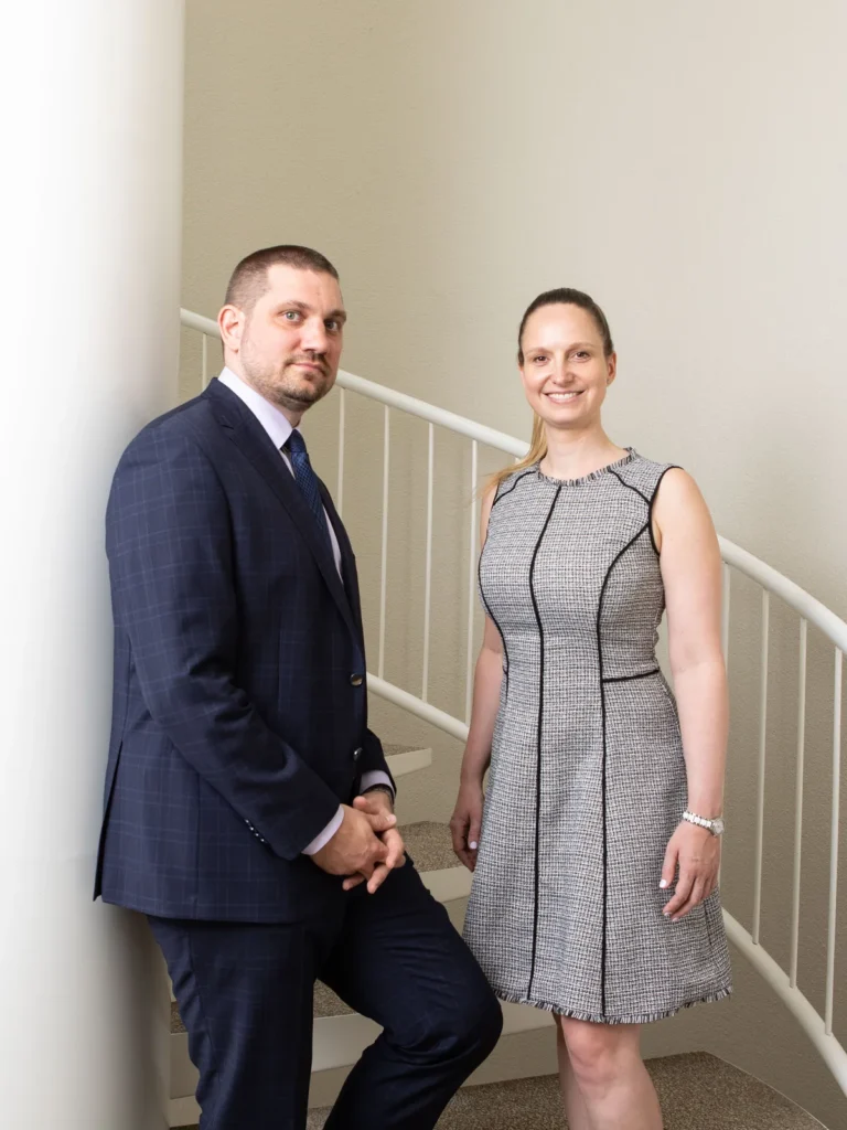 Two members of the CONSAVO team in the firm's stairwell in Zurich